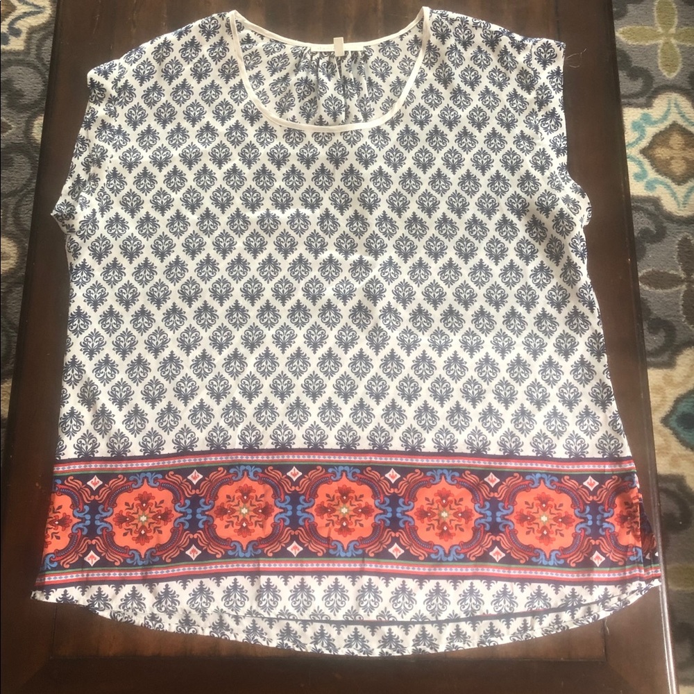 Shiny white top with fun patterns